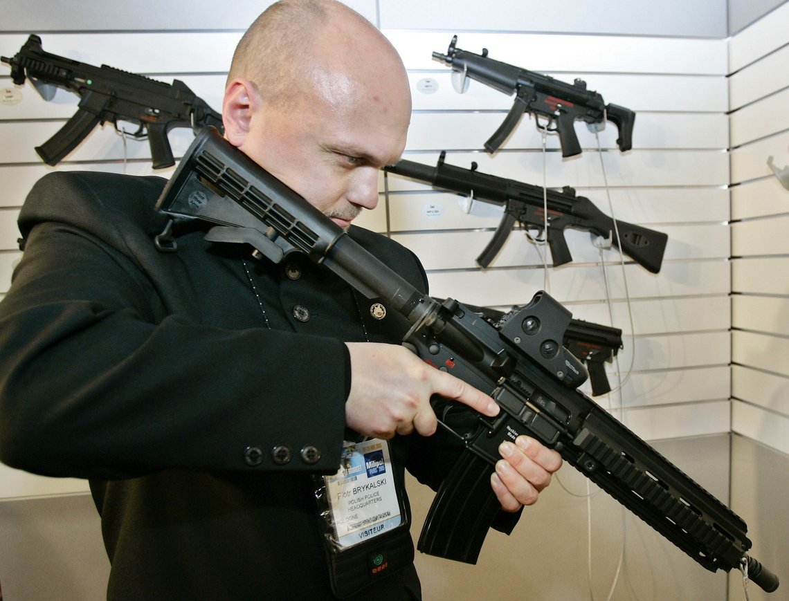 Police officer Piotr Brykalski from Poland looks at the new HK416 enhanced carbine designed by German firm Heckler and Koch at the 14th Paris Milipol 2005, the worldwide exhibition of internal state security, at Le Bourget , north of Paris, Tuesday Nov. 22, 2005. (AP Photo/Francois Mori) Police officer Piotr Brykalski from Poland looks at the new HK416 enhanced carbine designed by German firm Heckler and Koch at the 14th Paris Milipol 2005, the worldwide exhibition of internal state security, at Le Bourget , north of Paris, Tuesday Nov. 22, 2005. (AP Photo/Francois Mori)