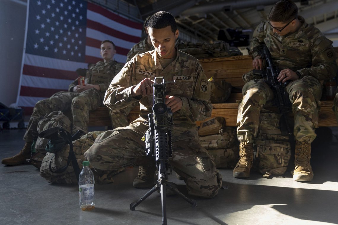 Members of the 82nd Airborne Division of the U.S. Army clean weaponry ahead of deployment to Poland from Fort Bragg, N.C. on Monday, Feb. 14, 2022. They are among soldiers the Department of Defense is sending in a demonstration of American commitment to NATO allies worried at the prospect of Russia invading Ukraine. (AP Photo/Nathan Posner) Members of the 82nd Airborne Division of the U.S. Army clean weaponry ahead of deployment to Poland from Fort Bragg, N.C. on Monday, Feb. 14, 2022. They are among soldiers the Department of Defense is sending in a demonstration of American commitment to NATO allies worried at the prospect of Russia invading Ukraine. (AP Photo/Nathan Posner)