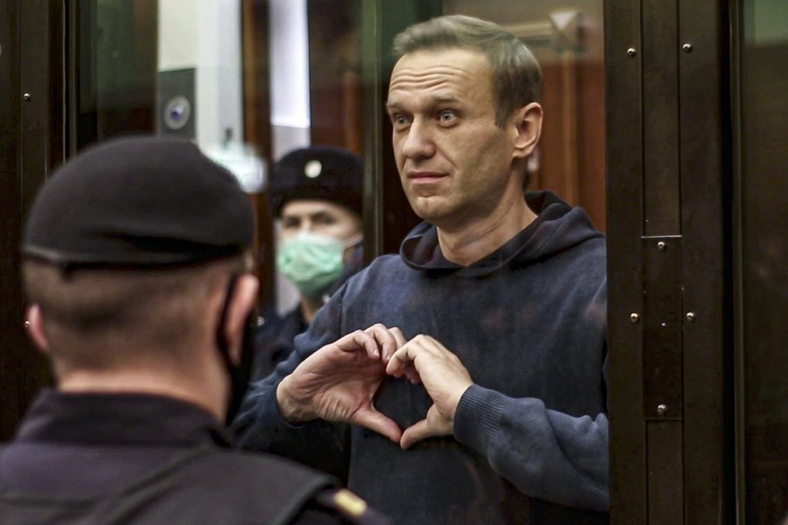 FILE - In this image from video provided by the Moscow City Court, opposition leader Alexei Navalny makes a heart symbol standing in a cage during a hearing to convert the suspended sentence of Navalny from the 2014 criminal conviction into a real prison term, in Moscow, Russia, on Wednesday, Feb. 3, 2021, The prison sentence on the leading Kremlin critic was a severe blow to Russia's opposition — and then the situation got worse. (Moscow City Court via AP, File) FILE - In this image from video provided by the Moscow City Court, opposition leader Alexei Navalny makes a heart symbol standing in a cage during a hearing to convert the suspended sentence of Navalny from the 2014 criminal conviction into a real prison term, in Moscow, Russia, on Wednesday, Feb. 3, 2021, The prison sentence on the leading Kremlin critic was a severe blow to Russia's opposition — and then the situation got worse. (Moscow City Court via AP, File)