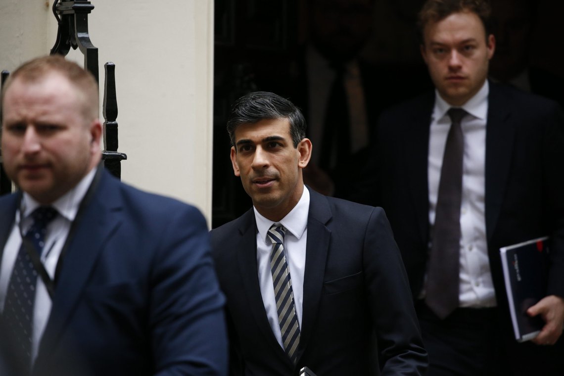 British Chancellor of the Exchequer Rishi Sunak, centre, leaves 11 Downing Street in London, Tuesday, Feb. 22, 2022. (AP Photo/David Cliff) British Chancellor of the Exchequer Rishi Sunak, centre, leaves 11 Downing Street in London, Tuesday, Feb. 22, 2022. (AP Photo/David Cliff)