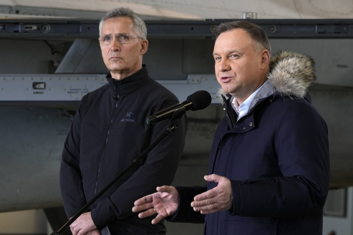 NATO Secretary General Jens Stoltenberg, left, and Polish President Andrzej Duda address the media at Lask air base in Poland, Tuesday, March 1, 2022. Their meeting took place as Russian shelling pounded civilian targets in Ukraine's second-largest city again Tuesday and a 40-mile convoy of tanks and other vehicles threatened the capital Kyiv. (AP Photo/Czarek Sokolowski) NATO Secretary General Jens Stoltenberg, left, and Polish President Andrzej Duda address the media at Lask air base in Poland, Tuesday, March 1, 2022. Their meeting took place as Russian shelling pounded civilian targets in Ukraine's second-largest city again Tuesday and a 40-mile convoy of tanks and other vehicles threatened the capital Kyiv. (AP Photo/Czarek Sokolowski)