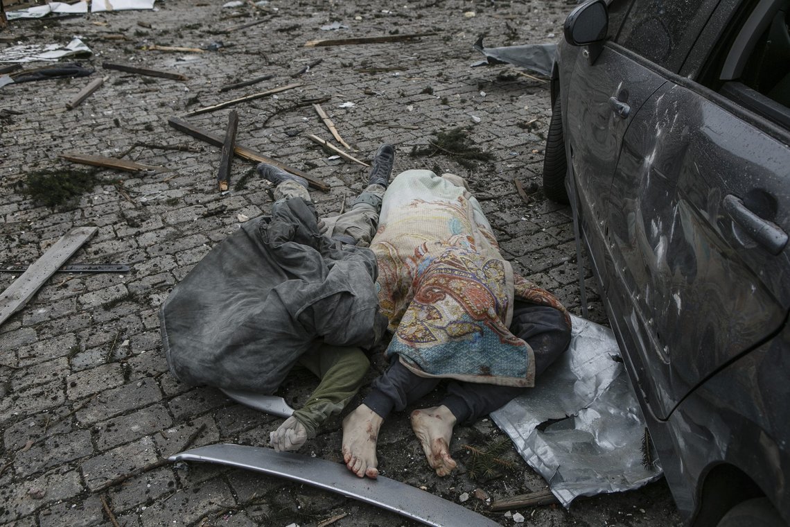 EDS NOTE: GRAPHIC CONTENT - Lifeless bodies lie in the central square following shelling of the City Hall building in Kharkiv, Ukraine, Tuesday, March 1, 2022. Russia on Tuesday stepped up shelling of Kharkiv, Ukraine's second-largest city, pounding civilian targets there. Casualties mounted and reports emerged that more than 70 Ukrainian soldiers were killed after Russian artillery recently hit a military base in Okhtyrka, a city between Kharkiv and Kyiv, the capital. (AP Photo/Pavel Dorogoy) EDS NOTE: GRAPHIC CONTENT - Lifeless bodies lie in the central square following shelling of the City Hall building in Kharkiv, Ukraine, Tuesday, March 1, 2022. Russia on Tuesday stepped up shelling of Kharkiv, Ukraine's second-largest city, pounding civilian targets there. Casualties mounted and reports emerged that more than 70 Ukrainian soldiers were killed after Russian artillery recently hit a military base in Okhtyrka, a city between Kharkiv and Kyiv, the capital. (AP Photo/Pavel Dorogoy)