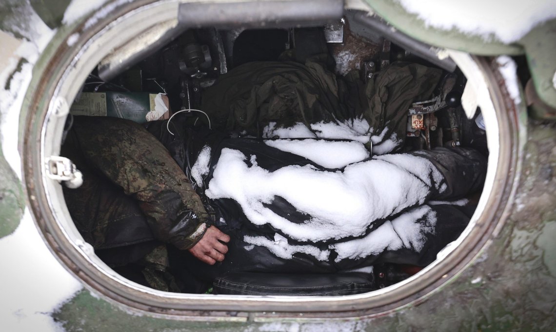 The dead bodies of soldiers are seen in military vehicle on a road in the town of Bucha, close to the capital Kyiv, Ukraine, Tuesday, March 1, 2022. Russia on Tuesday stepped up shelling of Kharkiv, Ukraine's second-largest city, pounding civilian targets there. Casualties mounted and reports emerged that more than 70 Ukrainian soldiers were killed after Russian artillery recently hit a military base in Okhtyrka, a city between Kharkiv and Kyiv, the capital. (AP Photo/Serhii Nuzhnenko) The dead bodies of soldiers are seen in military vehicle on a road in the town of Bucha, close to the capital Kyiv, Ukraine, Tuesday, March 1, 2022. Russia on Tuesday stepped up shelling of Kharkiv, Ukraine's second-largest city, pounding civilian targets there. Casualties mounted and reports emerged that more than 70 Ukrainian soldiers were killed after Russian artillery recently hit a military base in Okhtyrka, a city between Kharkiv and Kyiv, the capital. (AP Photo/Serhii Nuzhnenko)