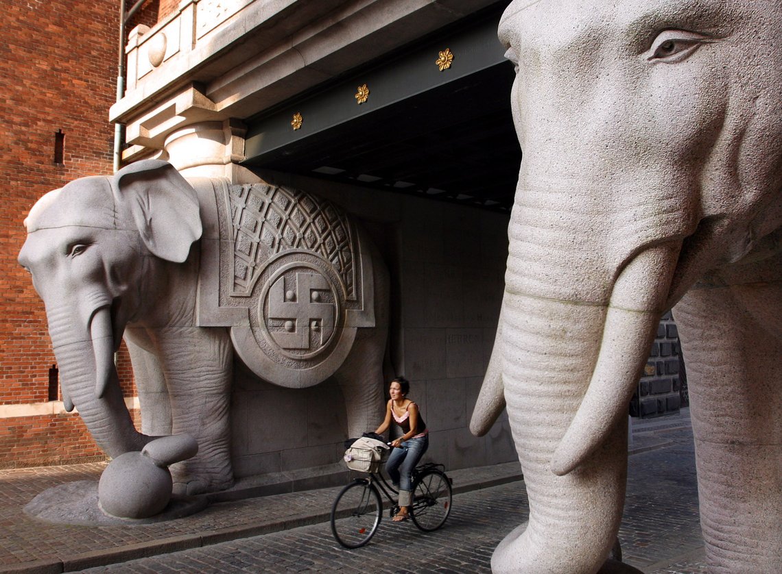 A woman rides her bike past the Carlsberg Elephants at the brewery in Copenhagen, Denmark Thursday Aug. 12, 2004. Carlsberg, the fifth largest brewery in the world, on Thursday reported a 76 percent drop in second quarter net profits due to a reduction of debt, restructuring costs and tough competition. (AP Photo/John McConnico) A woman rides her bike past the Carlsberg Elephants at the brewery in Copenhagen, Denmark Thursday Aug. 12, 2004. Carlsberg, the fifth largest brewery in the world, on Thursday reported a 76 percent drop in second quarter net profits due to a reduction of debt, restructuring costs and tough competition. (AP Photo/John McConnico)