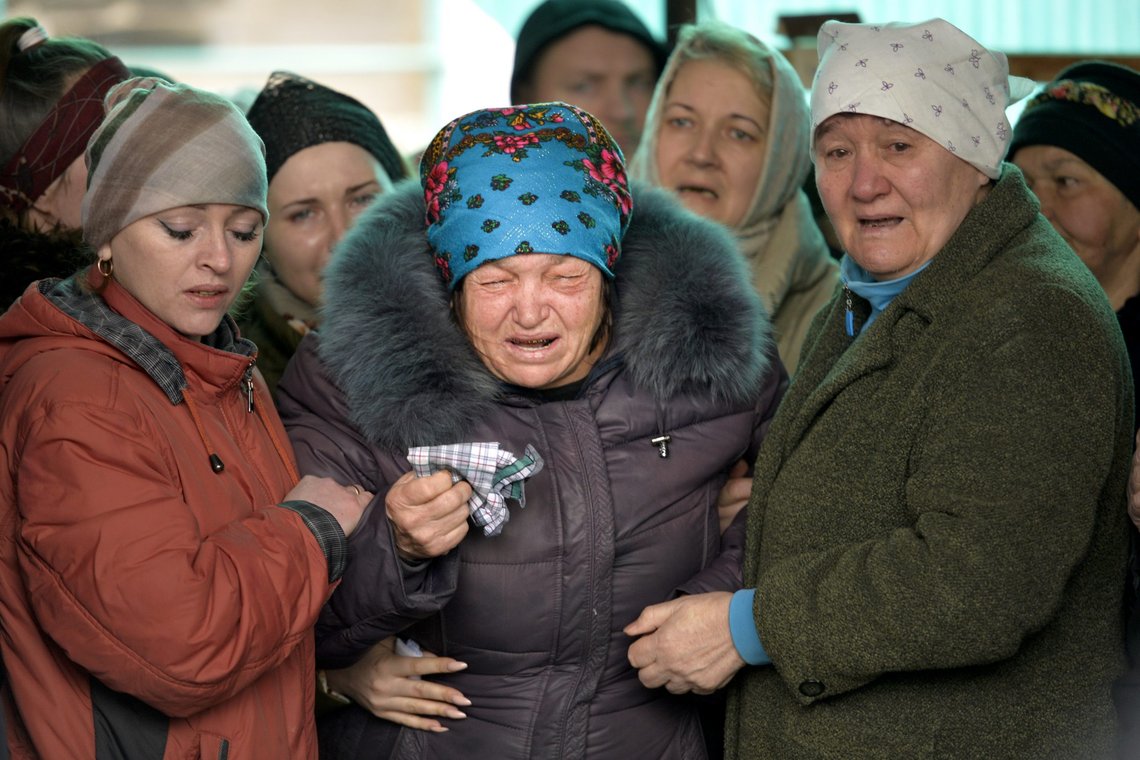 The mother of Russian Army soldier Rustam Zarifulin, who was killed fighting in Ukraine, cries surrounded by relatives during a farewell ceremony in his hometown of Kara-Balta, west of Bishkek, Kyrgyzstan, Sunday, March 27, 2022. (AP Photo/Vladimir Voronin) The mother of Russian Army soldier Rustam Zarifulin, who was killed fighting in Ukraine, cries surrounded by relatives during a farewell ceremony in his hometown of Kara-Balta, west of Bishkek, Kyrgyzstan, Sunday, March 27, 2022. (AP Photo/Vladimir Voronin)