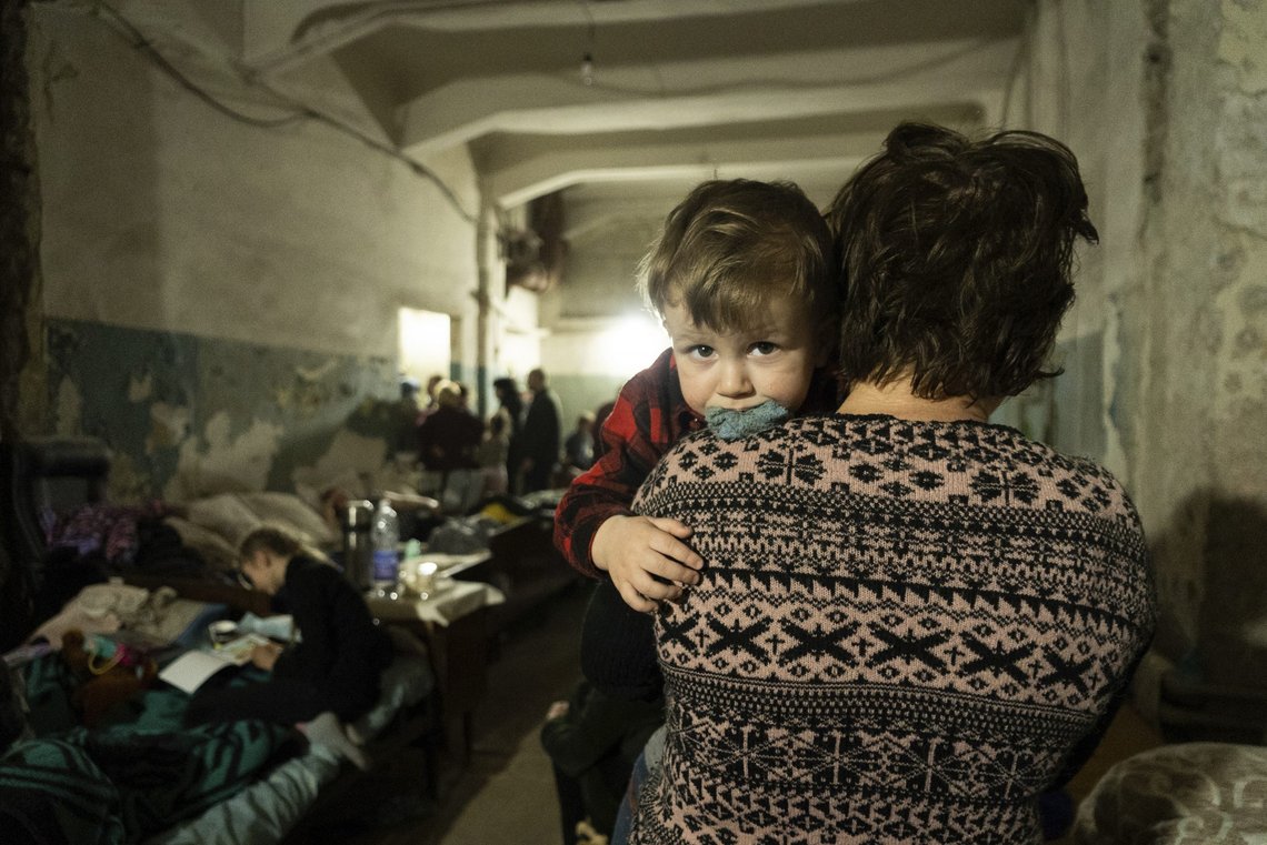 A woman holds a child in an improvised bomb shelter in Mariupol, Ukraine, Monday, March 7, 2022. (AP Photo/Mstyslav Chernov) A woman holds a child in an improvised bomb shelter in Mariupol, Ukraine, Monday, March 7, 2022. (AP Photo/Mstyslav Chernov)