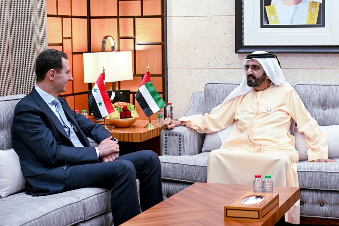 In this photo released by Emirates News Agency, WAM, Sheikh Mohammed bin Rashid Al Maktoum, UAE prime minister and ruler of Dubai, right, talks to Syrian President Bashar Assad during their meeting in Dubai, United Arab Emirates, Friday, March 18, 2022. Assad travelled to the United Arab Emirates, marking his first visit to an Arab country since Syria's civil war erupted in 2011, his office said Friday. (Emirates News Agency via AP) In this photo released by Emirates News Agency, WAM, Sheikh Mohammed bin Rashid Al Maktoum, UAE prime minister and ruler of Dubai, right, talks to Syrian President Bashar Assad during their meeting in Dubai, United Arab Emirates, Friday, March 18, 2022. Assad travelled to the United Arab Emirates, marking his first visit to an Arab country since Syria's civil war erupted in 2011, his office said Friday. (Emirates News Agency via AP)