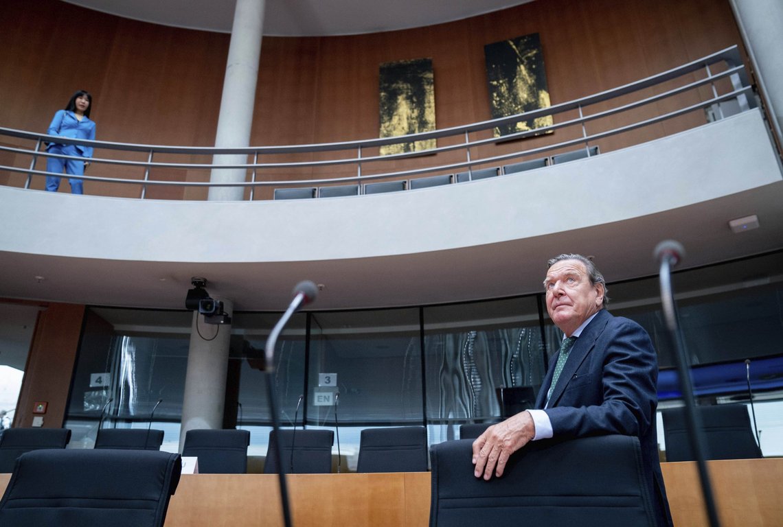 FILE - Former German Chancellor and head of the Nord Stream 2 administrative board Gerhard Schroder, foreground and his wife Soyeon Schroeder-Kim wait for the start of a hearing in the Bundestag's Economic Committee on the Nord Stream 2 pipeline project in Berlin, Germany, July 1, 2020. German Chancellor Olaf Scholz is flying to Washington this week to reassure Americans that his country stands alongside the United States and other NATO partners in opposing any Russian aggression against Ukraine. Scholz has publicly said that Moscow would pay a “high price” in the event of an attack. (Kay Nietfeld/dpa via AP, File) FILE - Former German Chancellor and head of the Nord Stream 2 administrative board Gerhard Schroder, foreground and his wife Soyeon Schroeder-Kim wait for the start of a hearing in the Bundestag's Economic Committee on the Nord Stream 2 pipeline project in Berlin, Germany, July 1, 2020. German Chancellor Olaf Scholz is flying to Washington this week to reassure Americans that his country stands alongside the United States and other NATO partners in opposing any Russian aggression against Ukraine. Scholz has publicly said that Moscow would pay a “high price” in the event of an attack. (Kay Nietfeld/dpa via AP, File)