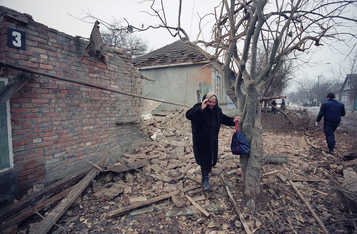 FILE - Chechen citizens look over the rubble of destroyed houses during a lull in the fighting in Grozny on Jan. 1, 1995. The Russian airstrike on a children’s and maternity hospital in the Ukrainian port city of Mariupol is the latest in a series of attacks that has gutted apartment blocks and killed people in their homes or simply going about their business. Allegations of war crimes, impossible yet to prove, are mounting and an investigation is underway at the International Criminal Court. Russia’s willingness to use overwhelming force – aerial bombardment and artillery in civilian areas – is already drawing comparisons with its attacks in Chechnya and Syria. (AP Photo/Mindaugas Kulbis, File) FILE - Chechen citizens look over the rubble of destroyed houses during a lull in the fighting in Grozny on Jan. 1, 1995. The Russian airstrike on a children’s and maternity hospital in the Ukrainian port city of Mariupol is the latest in a series of attacks that has gutted apartment blocks and killed people in their homes or simply going about their business. Allegations of war crimes, impossible yet to prove, are mounting and an investigation is underway at the International Criminal Court. Russia’s willingness to use overwhelming force – aerial bombardment and artillery in civilian areas – is already drawing comparisons with its attacks in Chechnya and Syria. (AP Photo/Mindaugas Kulbis, File)