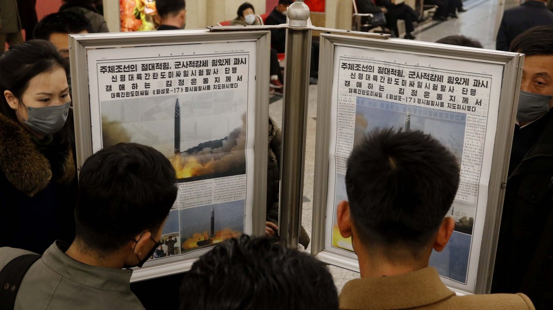 People look at a copy of North Korean newspaper Rodong Sinmun which reports the test launch of a missile, at the Jonsung Station of Pyongyang Metro in Pyongyang, North Korea, Friday, March 25, 2022. North Korea said Friday it test-fired its biggest intercontinental ballistic missile under the orders of leader Kim Jong Un, who vowed to expand the North’s “nuclear war deterrent” while preparing for a “long-standing confrontation” with the United States.(AP Photo/Cha Song Ho) People look at a copy of North Korean newspaper Rodong Sinmun which reports the test launch of a missile, at the Jonsung Station of Pyongyang Metro in Pyongyang, North Korea, Friday, March 25, 2022. North Korea said Friday it test-fired its biggest intercontinental ballistic missile under the orders of leader Kim Jong Un, who vowed to expand the North’s “nuclear war deterrent” while preparing for a “long-standing confrontation” with the United States.(AP Photo/Cha Song Ho)