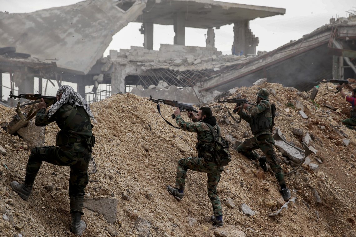 FILE - Syrian army soldiers fire their weapons during a battle with rebel fighters at the Ramouseh front line, east of Aleppo, Syria, Monday, Dec. 5, 2016. Tuesday, March 15, 2022 marks the 11th anniversary of Syria's revolution-turned-civil war. This year, many survivors are watching in shock as Ukrainians face the same horrors they did. (AP Photo/Hassan Ammar, File) FILE - Syrian army soldiers fire their weapons during a battle with rebel fighters at the Ramouseh front line, east of Aleppo, Syria, Monday, Dec. 5, 2016. Tuesday, March 15, 2022 marks the 11th anniversary of Syria's revolution-turned-civil war. This year, many survivors are watching in shock as Ukrainians face the same horrors they did. (AP Photo/Hassan Ammar, File)