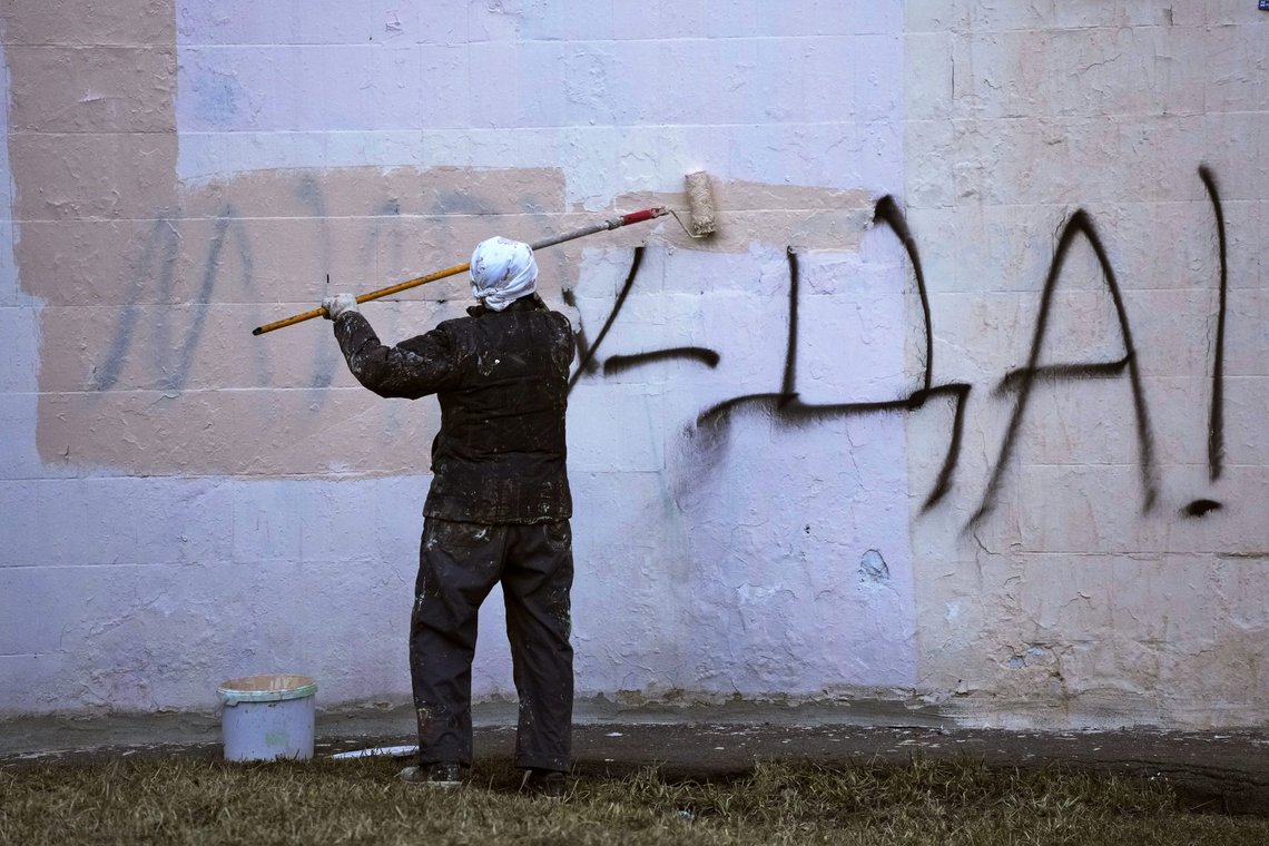 FILE - A worker paints over a writing reading 'Yes to Peace!' on a wall of an apartment building in St. Petersburg, Russia, Friday, March 18, 2022. (AP Photo, File) FILE - A worker paints over a writing reading 'Yes to Peace!' on a wall of an apartment building in St. Petersburg, Russia, Friday, March 18, 2022. (AP Photo, File)