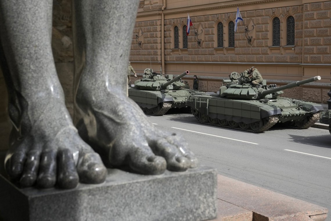 Soldiers prepare their Russian T-72 tanks prior to a rehearsal for the Victory Day military parade which will take place at Dvortsovaya (Palace) Square on May 9 to celebrate 77 years after the victory in World War II in St. Petersburg, Russia, Thursday, April 28, 2022, with feet of a famous sculpture of Atlas at the State Hermitage museum in the foreground. (AP Photo/Dmitri Lovetsky) Soldiers prepare their Russian T-72 tanks prior to a rehearsal for the Victory Day military parade which will take place at Dvortsovaya (Palace) Square on May 9 to celebrate 77 years after the victory in World War II in St. Petersburg, Russia, Thursday, April 28, 2022, with feet of a famous sculpture of Atlas at the State Hermitage museum in the foreground. (AP Photo/Dmitri Lovetsky)