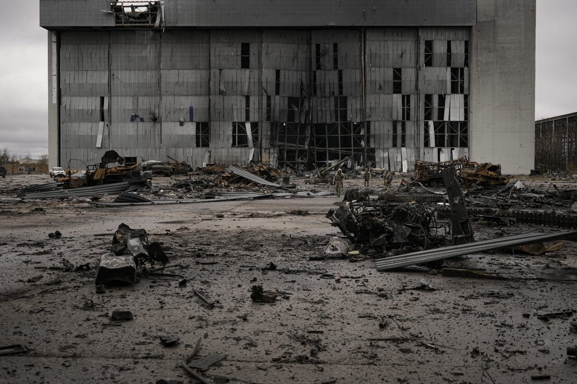 Ukrainian servicemen walks on a tarmac littered with destroyed Russian military vehicles at the Antonov airport in Hostomel, Ukraine, Saturday, April 2, 2022. At the entrance of Antonov Airport troops manned their positions, a sign they are in full control of the runway that Russia tried to storm in the first days of the war. (AP Photo/Vadim Ghirda) Ukrainian servicemen walks on a tarmac littered with destroyed Russian military vehicles at the Antonov airport in Hostomel, Ukraine, Saturday, April 2, 2022. At the entrance of Antonov Airport troops manned their positions, a sign they are in full control of the runway that Russia tried to storm in the first days of the war. (AP Photo/Vadim Ghirda)