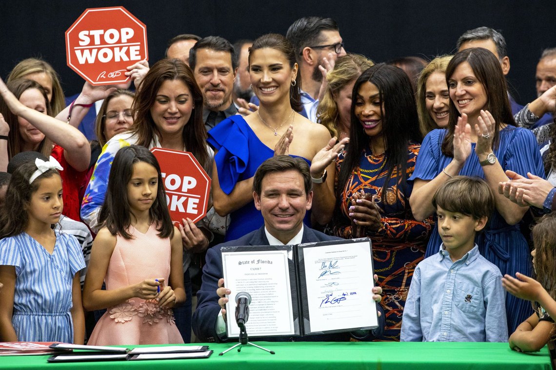 Florida Gov. Ron DeSantis reacts after publicly signing HB7, "individual freedom," also dubbed the "stop woke" bill during a news conference at Mater Academy Charter Middle/High School in Hialeah Gardens, Fla., on Friday, April 22, 2022. DeSantis also signed two other bills into laws including one regarding the "big tech" bill signed last year but set aside due to a court ruling, and the special districts bill, which relates to the Reedy Creek Improvement District. (Daniel A. Varela/Miami Herald via AP) Florida Gov. Ron DeSantis reacts after publicly signing HB7, "individual freedom," also dubbed the "stop woke" bill during a news conference at Mater Academy Charter Middle/High School in Hialeah Gardens, Fla., on Friday, April 22, 2022. DeSantis also signed two other bills into laws including one regarding the "big tech" bill signed last year but set aside due to a court ruling, and the special districts bill, which relates to the Reedy Creek Improvement District. (Daniel A. Varela/Miami Herald via AP)