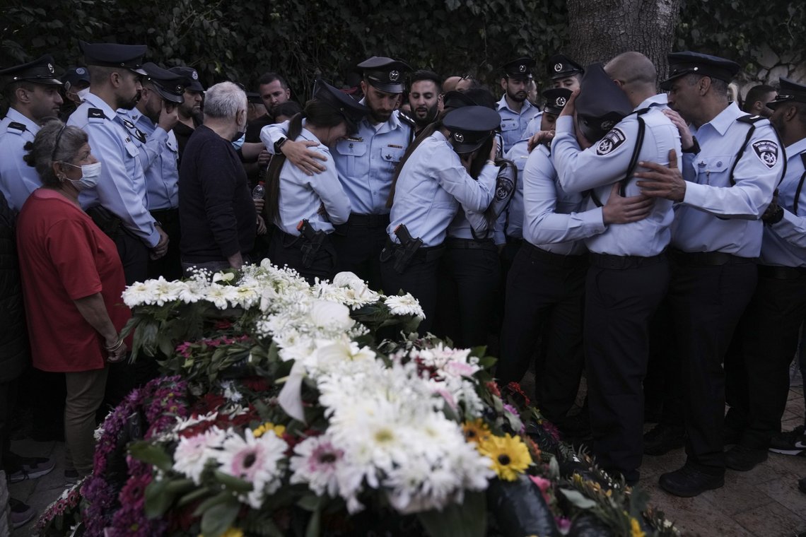 Israeli police officers weep for their slain colleague, Israeli Christian police officer Amir Khoury during his funeral in Nof Hagalil, Israel, Thursday, March 31, 2022. Khoury was one of five killed by a Palestinian gunman in a crowded city in central Israel late Tuesday, the second mass shooting rampage this week. The shooter was killed by police. (AP Photo/Ariel Schalit) Israeli police officers weep for their slain colleague, Israeli Christian police officer Amir Khoury during his funeral in Nof Hagalil, Israel, Thursday, March 31, 2022. Khoury was one of five killed by a Palestinian gunman in a crowded city in central Israel late Tuesday, the second mass shooting rampage this week. The shooter was killed by police. (AP Photo/Ariel Schalit)