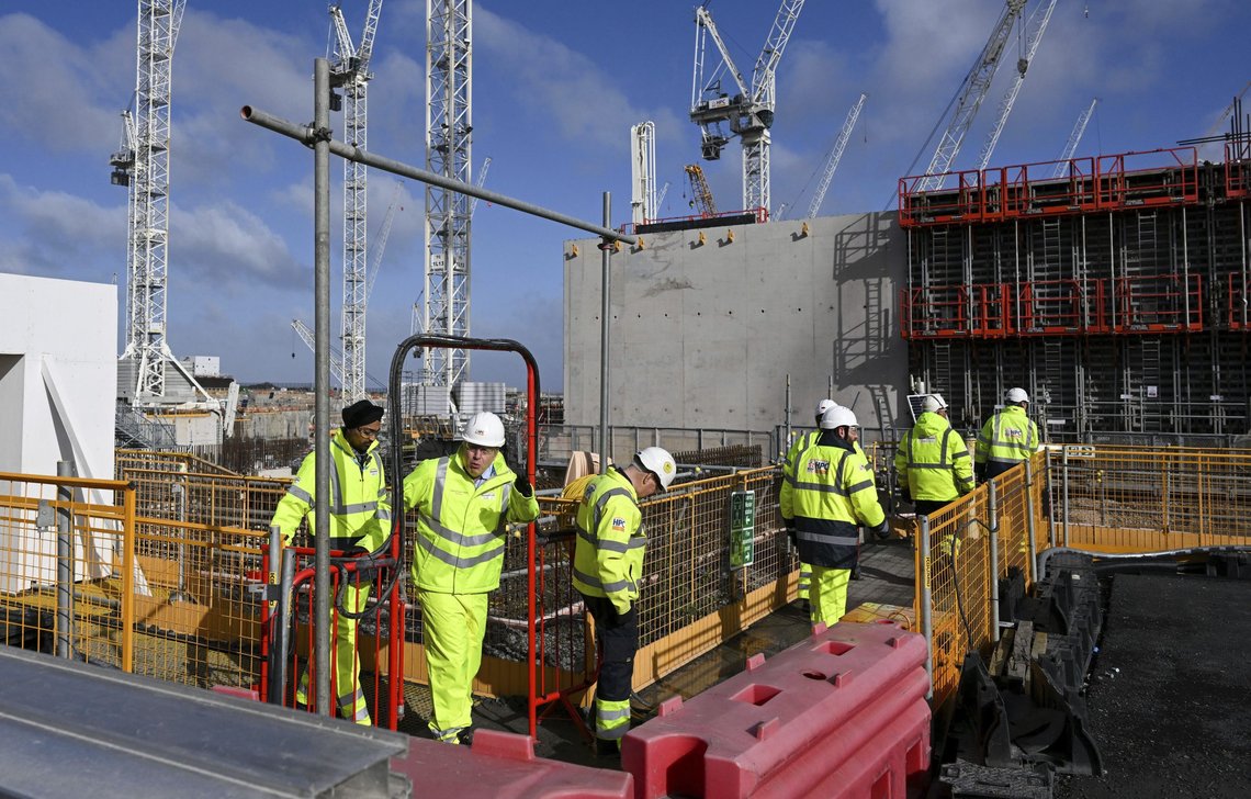 Britain's Prime Minister Boris Johnson during a visit to Hinkley Point C nuclear power station construction site in Somerset, England, Thursday, April 7, 2022. Britain plans to build eight new nuclear reactors and expand production of wind energy as it seeks to reduce dependence on oil and natural gas from Russia and other foreign suppliers following the invasion of Ukraine. (Finnbarr Webster/Pool Photo via AP) Britain's Prime Minister Boris Johnson during a visit to Hinkley Point C nuclear power station construction site in Somerset, England, Thursday, April 7, 2022. Britain plans to build eight new nuclear reactors and expand production of wind energy as it seeks to reduce dependence on oil and natural gas from Russia and other foreign suppliers following the invasion of Ukraine. (Finnbarr Webster/Pool Photo via AP)