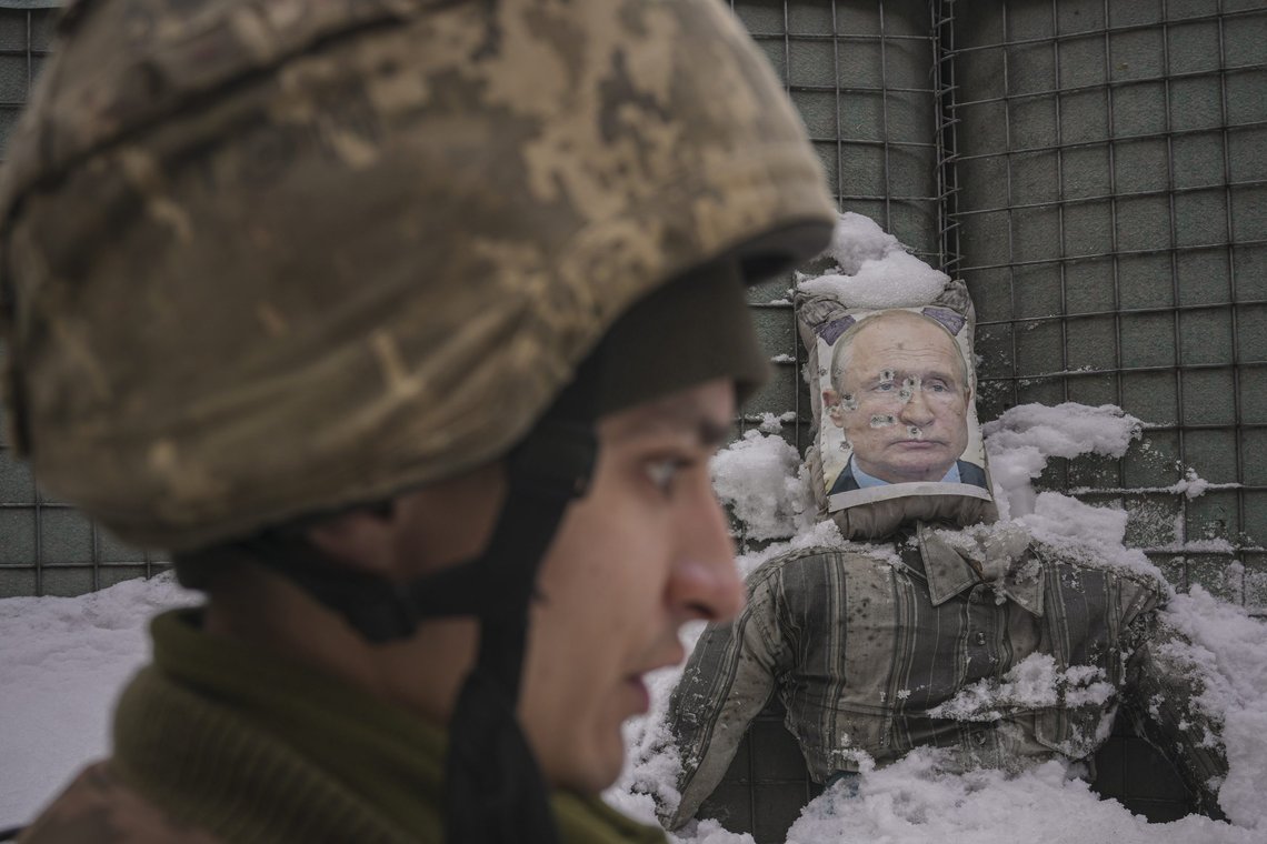A Ukrainian serviceman speaks, backdropped by a bullet riddled effigy of Russian President Vladimir Putin, during a media interview at a frontline position in the Luhansk region, eastern Ukraine, Tuesday, Feb. 1, 2022. (AP Photo/Vadim Ghirda) A Ukrainian serviceman speaks, backdropped by a bullet riddled effigy of Russian President Vladimir Putin, during a media interview at a frontline position in the Luhansk region, eastern Ukraine, Tuesday, Feb. 1, 2022. (AP Photo/Vadim Ghirda)