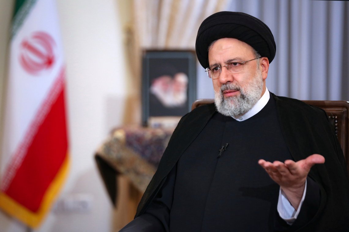In this photo released by the official website of the office of the Iranian Presidency, President Ebrahim Raisi speaks in a live interview with state-run TV, at the presidency office in Tehran, Iran, Monday, May 9, 2022. Raisi said the country is exporting twice as much oil as when he took office in August, despite heavy sanctions on oil exports imposed by the U.S. (Iranian Presidency Office via AP) In this photo released by the official website of the office of the Iranian Presidency, President Ebrahim Raisi speaks in a live interview with state-run TV, at the presidency office in Tehran, Iran, Monday, May 9, 2022. Raisi said the country is exporting twice as much oil as when he took office in August, despite heavy sanctions on oil exports imposed by the U.S. (Iranian Presidency Office via AP)