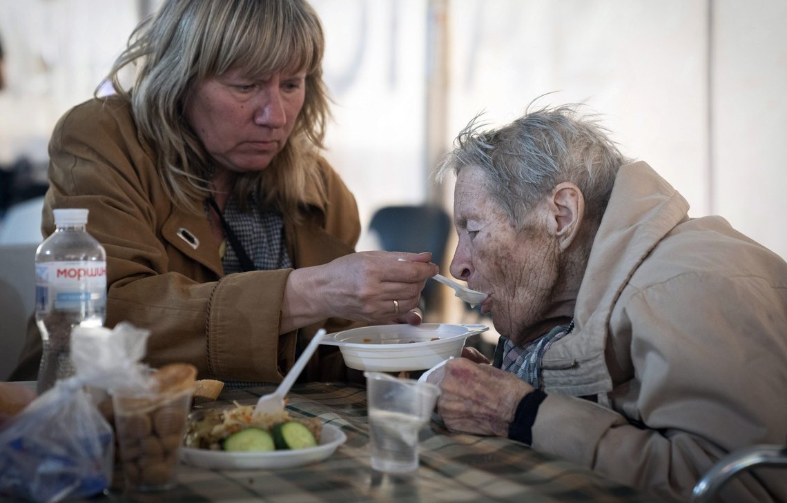 People have a meal after arriving from the Ukrainian city of Mariupol at a center for displaced people in Zaporizhzhia, Ukraine, Tuesday, May 3, 2022. (AP Photo/Evgeniy Maloletka) People have a meal after arriving from the Ukrainian city of Mariupol at a center for displaced people in Zaporizhzhia, Ukraine, Tuesday, May 3, 2022. (AP Photo/Evgeniy Maloletka)