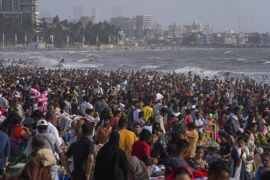 People crowd the Juhu beach on the Arabian Sea coast on a hot and humid day in Mumbai, India, Sunday, May 8, 2022. (AP Photo/Rafiq Maqbool) People crowd the Juhu beach on the Arabian Sea coast on a hot and humid day in Mumbai, India, Sunday, May 8, 2022. (AP Photo/Rafiq Maqbool)
