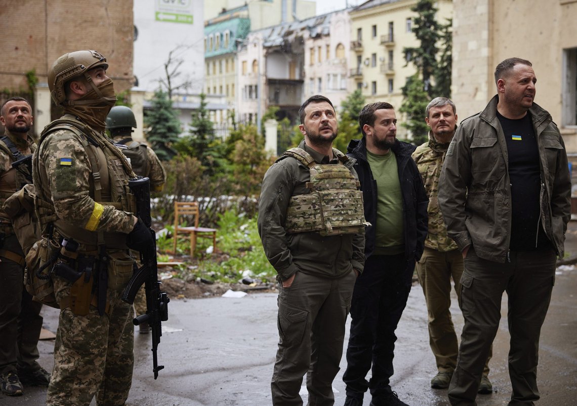 In this photo provided by the Ukrainian Presidential Press Office on Sunday, May 29, 2022, Ukrainian President Volodymyr Zelenskyy, centre, inspects damaged buildings, as he visits the war-hit Kharkiv region. Volodymyr Zelenskyy described the situation in the east as "indescribably difficult." The "Russian army is trying to squeeze at least some result" by concentrating its attacks there, he said in a Saturday night video address. (Ukrainian Presidential Press Office via AP) In this photo provided by the Ukrainian Presidential Press Office on Sunday, May 29, 2022, Ukrainian President Volodymyr Zelenskyy, centre, inspects damaged buildings, as he visits the war-hit Kharkiv region. Volodymyr Zelenskyy described the situation in the east as "indescribably difficult." The "Russian army is trying to squeeze at least some result" by concentrating its attacks there, he said in a Saturday night video address. (Ukrainian Presidential Press Office via AP)