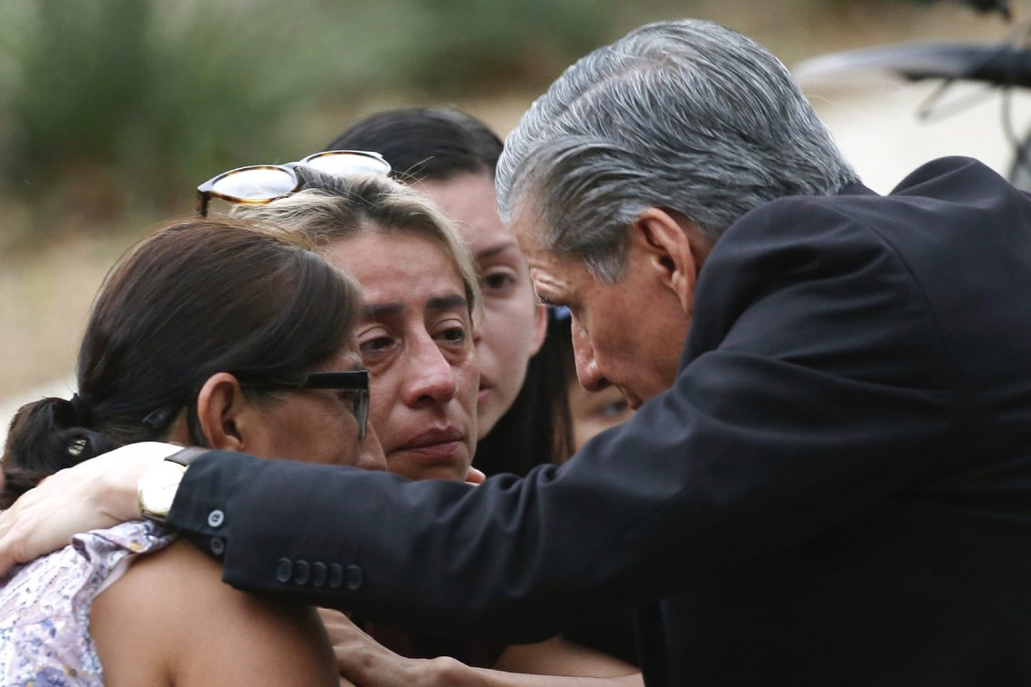 CORRECTS SPELLING TO GARCIA-SILLER, INSTEAD OF GARCIA SELLER - The archbishop of San Antonio, Gustavo Garcia-Siller, comforts families outside the Civic Center following a deadly school shooting at Robb Elementary School in Uvalde, Texas, Tuesday, May 24, 2022. (AP Photo/Dario Lopez-Mills) CORRECTS SPELLING TO GARCIA-SILLER, INSTEAD OF GARCIA SELLER - The archbishop of San Antonio, Gustavo Garcia-Siller, comforts families outside the Civic Center following a deadly school shooting at Robb Elementary School in Uvalde, Texas, Tuesday, May 24, 2022. (AP Photo/Dario Lopez-Mills)