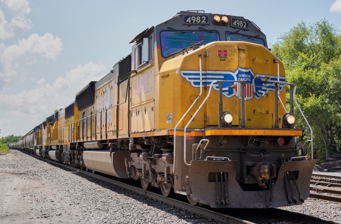 FILE - In this July 31, 2018, file photo a Union Pacific train travels through Union, Neb. Union Pacific's first-quarter profit declined 9% as the railroad delivered less freight and its revenue fell. A major fertilizer company says the limits Union Pacific is putting on rail traffic to clear up congestion will delay shipments that farmers need during the spring planting season. (AP Photo/Nati Harnik, File) FILE - In this July 31, 2018, file photo a Union Pacific train travels through Union, Neb. Union Pacific's first-quarter profit declined 9% as the railroad delivered less freight and its revenue fell. A major fertilizer company says the limits Union Pacific is putting on rail traffic to clear up congestion will delay shipments that farmers need during the spring planting season. (AP Photo/Nati Harnik, File)