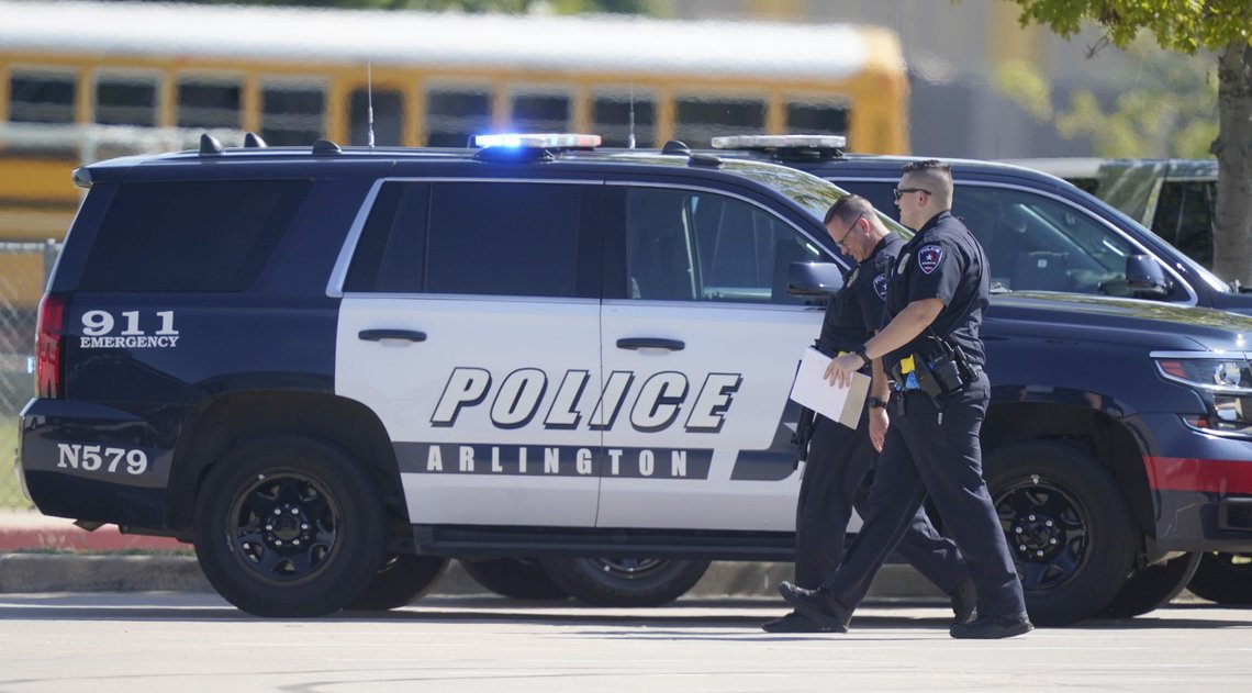 Law enforcement officers walk in the parking lot of Timberview High School after a shooting inside the school located in south Arlington, Texas, Wednesday, Oct. 6, 2021. (AP Photo/LM Otero) Law enforcement officers walk in the parking lot of Timberview High School after a shooting inside the school located in south Arlington, Texas, Wednesday, Oct. 6, 2021. (AP Photo/LM Otero)