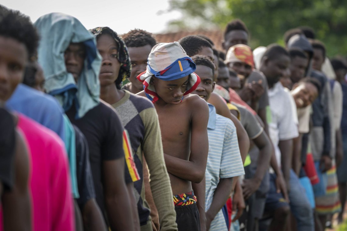 Haitians line up for breakfast at a campground being used to house a large group of Haitian migrants in Sierra Morena in Cuba's Villa Clara province, Thursday, May 26, 2022. A vessel carrying more than 800 Haitians trying to reach the United States wound up instead on the coast of central Cuba, in what appeared to be the largest group seen yet in a swelling exodus from crisis-stricken Haiti. (AP Photo Ramon Espinosa) Haitians line up for breakfast at a campground being used to house a large group of Haitian migrants in Sierra Morena in Cuba's Villa Clara province, Thursday, May 26, 2022. A vessel carrying more than 800 Haitians trying to reach the United States wound up instead on the coast of central Cuba, in what appeared to be the largest group seen yet in a swelling exodus from crisis-stricken Haiti. (AP Photo Ramon Espinosa)