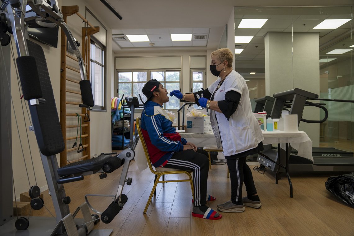 A man gets a PCR coronavirus test at a private nursing home in Netanya, Israel, Wednesday, Jan. 5, 2022. Israel says coronavirus infections in the country have spiked to a new record high since the start of the pandemic. (AP Photo/Ariel Schalit) A man gets a PCR coronavirus test at a private nursing home in Netanya, Israel, Wednesday, Jan. 5, 2022. Israel says coronavirus infections in the country have spiked to a new record high since the start of the pandemic. (AP Photo/Ariel Schalit)