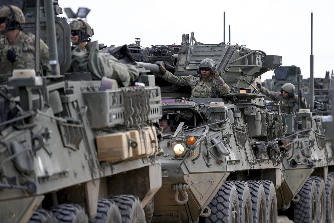 U.S. army soldiers drive armoured vehicles in a convoy at the Vay Adam Military Training Base near Hajduhadhaz, northeastern Hungary, Wednesday, June 15, 2022. The American unit carries out a joint patrol with Hungarian troops in County Szabolcs-Szatmar-Bereg bordering Ukraine. (Zsolt Czegledi/MTI via AP) U.S. army soldiers drive armoured vehicles in a convoy at the Vay Adam Military Training Base near Hajduhadhaz, northeastern Hungary, Wednesday, June 15, 2022. The American unit carries out a joint patrol with Hungarian troops in County Szabolcs-Szatmar-Bereg bordering Ukraine. (Zsolt Czegledi/MTI via AP)