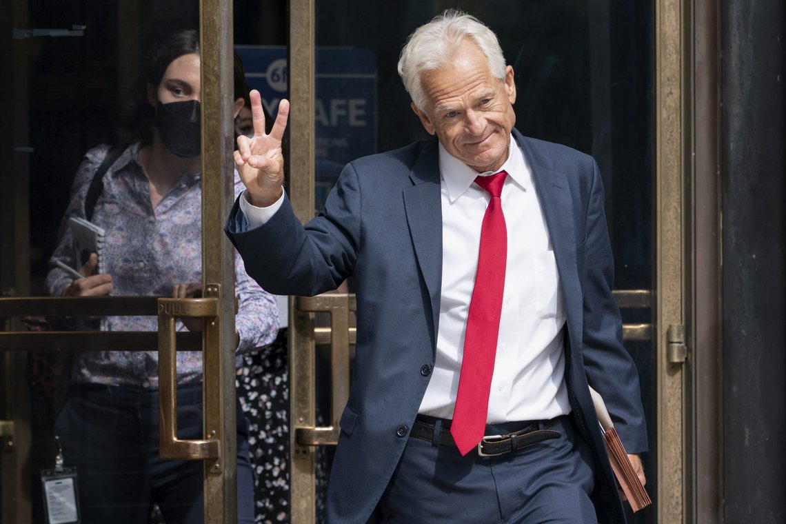 Former Trump White House official Peter Navarro gestures, Friday, June 3, 2022, as he leaves federal court in Washington. Navarro was indicted Friday on contempt charges after defying a subpoena from the House panel investigating the Jan. 6 attack on the U.S. Capitol. (AP Photo/Jacquelyn Martin) Former Trump White House official Peter Navarro gestures, Friday, June 3, 2022, as he leaves federal court in Washington. Navarro was indicted Friday on contempt charges after defying a subpoena from the House panel investigating the Jan. 6 attack on the U.S. Capitol. (AP Photo/Jacquelyn Martin)
