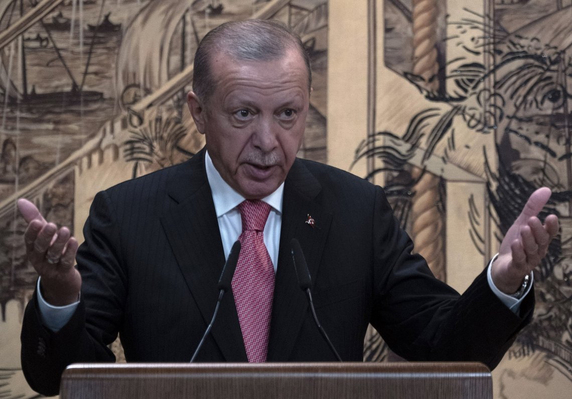 Turkish President Recep Tayyip Erdogan delivers a speach during a signing ceremony at Dolmabahce Palace in Istanbul, Turkey, Friday, July 22, 2022. U.N. Secretary General Antonio Guterres and Turkish President Recep Tayyip Erdogan were due on Friday to oversee the signing of a key agreement that would allow Ukraine to resume its shipment of grain from the Black Sea to world markets and for Russia to export grain and fertilizers, ending a standoff that has threatened world food security. (AP Photo/Khalil Hamra) Turkish President Recep Tayyip Erdogan delivers a speach during a signing ceremony at Dolmabahce Palace in Istanbul, Turkey, Friday, July 22, 2022. U.N. Secretary General Antonio Guterres and Turkish President Recep Tayyip Erdogan were due on Friday to oversee the signing of a key agreement that would allow Ukraine to resume its shipment of grain from the Black Sea to world markets and for Russia to export grain and fertilizers, ending a standoff that has threatened world food security. (AP Photo/Khalil Hamra)