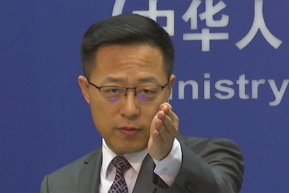 Chinese Foreign Ministry spokesperson Zhao Lijian gestures during a news conference at the Ministry of Foreign Affairs in Beijing, Wednesday, July 27, 2022. China's government on Wednesday rejected as a "political lie" a report by The Wall Street Journal that Beijing tried to recruit informants in the Federal Reserve system to obtain U.S. economic data. (AP Photo/Liu Zheng) Chinese Foreign Ministry spokesperson Zhao Lijian gestures during a news conference at the Ministry of Foreign Affairs in Beijing, Wednesday, July 27, 2022. China's government on Wednesday rejected as a "political lie" a report by The Wall Street Journal that Beijing tried to recruit informants in the Federal Reserve system to obtain U.S. economic data. (AP Photo/Liu Zheng)