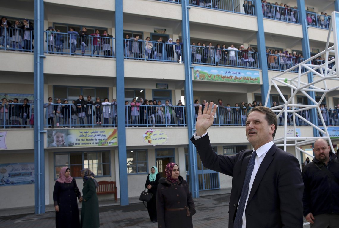 Mr. Pierre Krähenbühl, Commissioner-General of the United Nations Relief and Works Agency for Palestine Refugees, waves to refugee school girls on his arrival for a press conference to launch the global campaign to support UNRWA, at the UNRWA Rimal Girls Preparatory School in Gaza City, Monday, Jan. 22, 2018. The main U.N. agency for Palestinian refugees launched an "unprecedented" appeal seeking hundreds of millions of dollars in response to funding cuts by the Trump administration. (AP Photo/Adel Hana) Mr. Pierre Krähenbühl, Commissioner-General of the United Nations Relief and Works Agency for Palestine Refugees, waves to refugee school girls on his arrival for a press conference to launch the global campaign to support UNRWA, at the UNRWA Rimal Girls Preparatory School in Gaza City, Monday, Jan. 22, 2018. The main U.N. agency for Palestinian refugees launched an "unprecedented" appeal seeking hundreds of millions of dollars in response to funding cuts by the Trump administration. (AP Photo/Adel Hana)