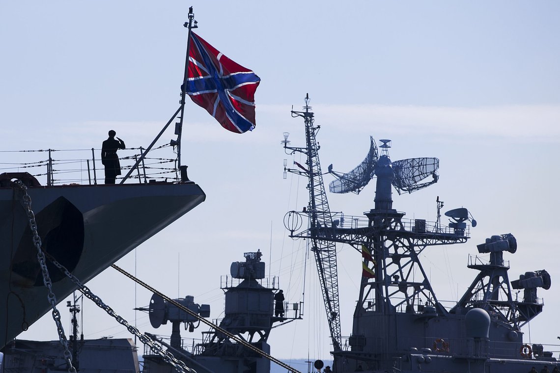 FILE - A Russian sailor salutes on the bow of Missile Cruiser Moskva, left, as crew of Russian patrol ship Pitliviy, right, prepare to moor the vessel, in Sevastopol, Crimea, March 30, 2014. The Moskva was built in Ukraine during the Soviet era and now is the flagship of Russia's Black Sea fleet in its war with Ukraine. (AP Photo/Pavel Golovkin, File) FILE - A Russian sailor salutes on the bow of Missile Cruiser Moskva, left, as crew of Russian patrol ship Pitliviy, right, prepare to moor the vessel, in Sevastopol, Crimea, March 30, 2014. The Moskva was built in Ukraine during the Soviet era and now is the flagship of Russia's Black Sea fleet in its war with Ukraine. (AP Photo/Pavel Golovkin, File)