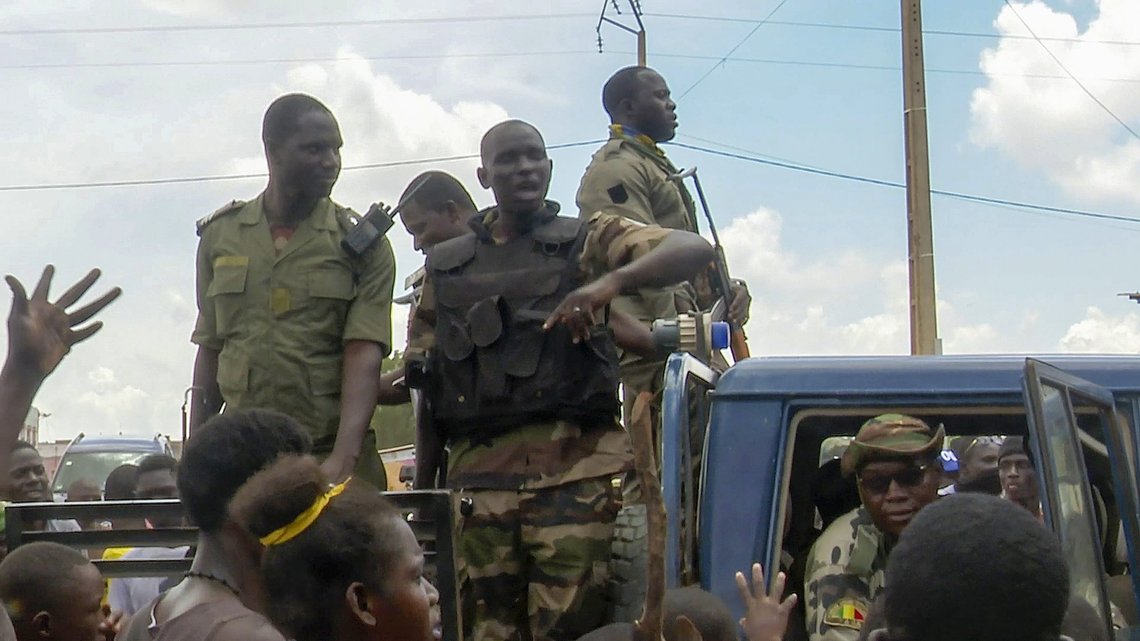 Malian soldiers are cheered by the population as they enter a military camp in Kati, Mali, Friday July 22, 2022. Mali's ruling junta says that jihadi rebels attacked the Kati military base on the outskirts of Bamako. It's the first time it has been targeted by extremist rebels in their more than 10-year insurgency in the West African country. The attack occurred at about 5 a.m. Friday morning when two vehicles loaded with explosives detonated at the camp. (AP Photo/Moustapha Diallo) Malian soldiers are cheered by the population as they enter a military camp in Kati, Mali, Friday July 22, 2022. Mali's ruling junta says that jihadi rebels attacked the Kati military base on the outskirts of Bamako. It's the first time it has been targeted by extremist rebels in their more than 10-year insurgency in the West African country. The attack occurred at about 5 a.m. Friday morning when two vehicles loaded with explosives detonated at the camp. (AP Photo/Moustapha Diallo)
