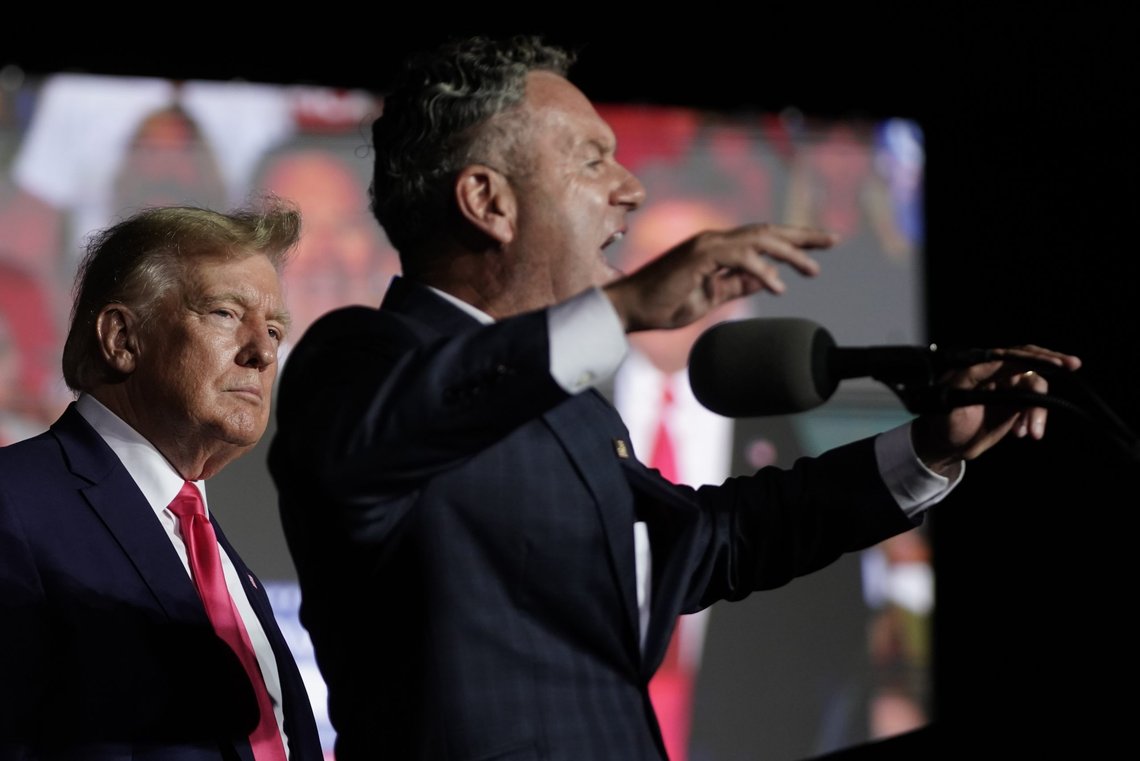 CORRECTS SPELLING OF LAST NAME TO MICHELS INSTEAD OF MICHAELS - Wisconsin Republican gubernatorial candidate Tim Michels, right, speaks as former President Donald Trump listens at a rally Friday, Aug. 5, 2022, in Waukesha, Wis. (AP Photo/Morry Gash) CORRECTS SPELLING OF LAST NAME TO MICHELS INSTEAD OF MICHAELS - Wisconsin Republican gubernatorial candidate Tim Michels, right, speaks as former President Donald Trump listens at a rally Friday, Aug. 5, 2022, in Waukesha, Wis. (AP Photo/Morry Gash)