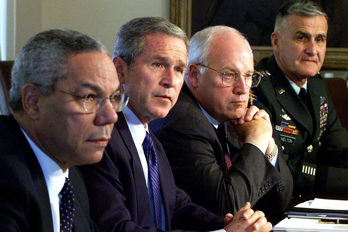 FILE - In this Wednesday, Sept. 12, 2001 file photo, from left, Secretary of State Colin Powell, President George W. Bush, Vice President Dick Cheney and Chairman of the Joint Chiefs of Staff Gen. Henry Shelton attend a meeting with the National Security Council in the Cabinet Room of the White House. While the Secret Service played “hide the president” with Bush on Sept. 11 — he was shuttled to military bases in Louisiana and Nebraska, for fear of terrorist attacks — his vice president hunkered down in a “secure, undisclosed location,” a bunker inside the White House where he helped direct the government’s actions. (AP Photo/Doug Mills, File) FILE - In this Wednesday, Sept. 12, 2001 file photo, from left, Secretary of State Colin Powell, President George W. Bush, Vice President Dick Cheney and Chairman of the Joint Chiefs of Staff Gen. Henry Shelton attend a meeting with the National Security Council in the Cabinet Room of the White House. While the Secret Service played “hide the president” with Bush on Sept. 11 — he was shuttled to military bases in Louisiana and Nebraska, for fear of terrorist attacks — his vice president hunkered down in a “secure, undisclosed location,” a bunker inside the White House where he helped direct the government’s actions. (AP Photo/Doug Mills, File)