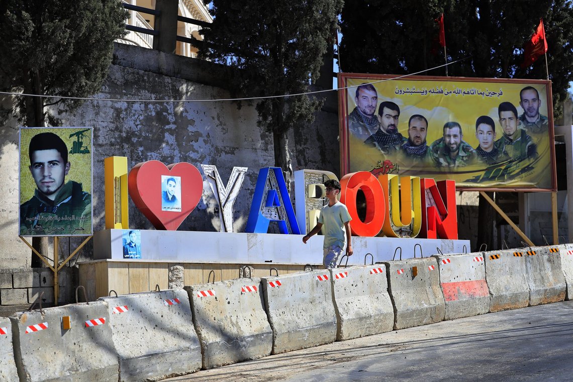 A Lebanese youth walks next to portraits of killed Hezbollah fighters in the Lebanese-Israeli border village of Yaroun, south Lebanon, Saturday, Aug. 13, 2022, where the parents of Hadi Matar emigrated from. On Friday, Matar, 24, born in Fairview, N.J., attacked author Salman Rushdie during a lecture in New York. His birth was a decade after "The Satanic Verses" was first published. (AP Photo/Mohammed Zaatari) A Lebanese youth walks next to portraits of killed Hezbollah fighters in the Lebanese-Israeli border village of Yaroun, south Lebanon, Saturday, Aug. 13, 2022, where the parents of Hadi Matar emigrated from. On Friday, Matar, 24, born in Fairview, N.J., attacked author Salman Rushdie during a lecture in New York. His birth was a decade after "The Satanic Verses" was first published. (AP Photo/Mohammed Zaatari)