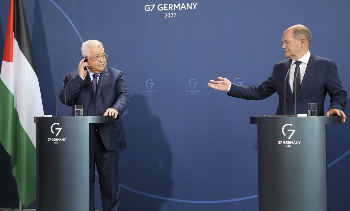 German Chancellor Olaf Scholz, right, and Mahmoud Abbas, President of the Palestinian Authority, answer questions from journalists at a press conference after their talks in Berlin, Germany, Tuesday, Aug.16, 2022. (Wolfgang Kumm/dpa via AP) German Chancellor Olaf Scholz, right, and Mahmoud Abbas, President of the Palestinian Authority, answer questions from journalists at a press conference after their talks in Berlin, Germany, Tuesday, Aug.16, 2022. (Wolfgang Kumm/dpa via AP)