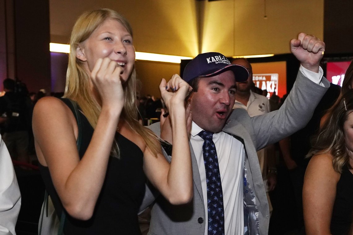 Campaign workers for Kari Lake, Republican candidate for Arizona governor, cheer positive election returns at the Lake election night party Tuesday, Aug. 2, 2022, in Scottsdale, Ariz. (AP Photo/Ross D. Franklin) Campaign workers for Kari Lake, Republican candidate for Arizona governor, cheer positive election returns at the Lake election night party Tuesday, Aug. 2, 2022, in Scottsdale, Ariz. (AP Photo/Ross D. Franklin)