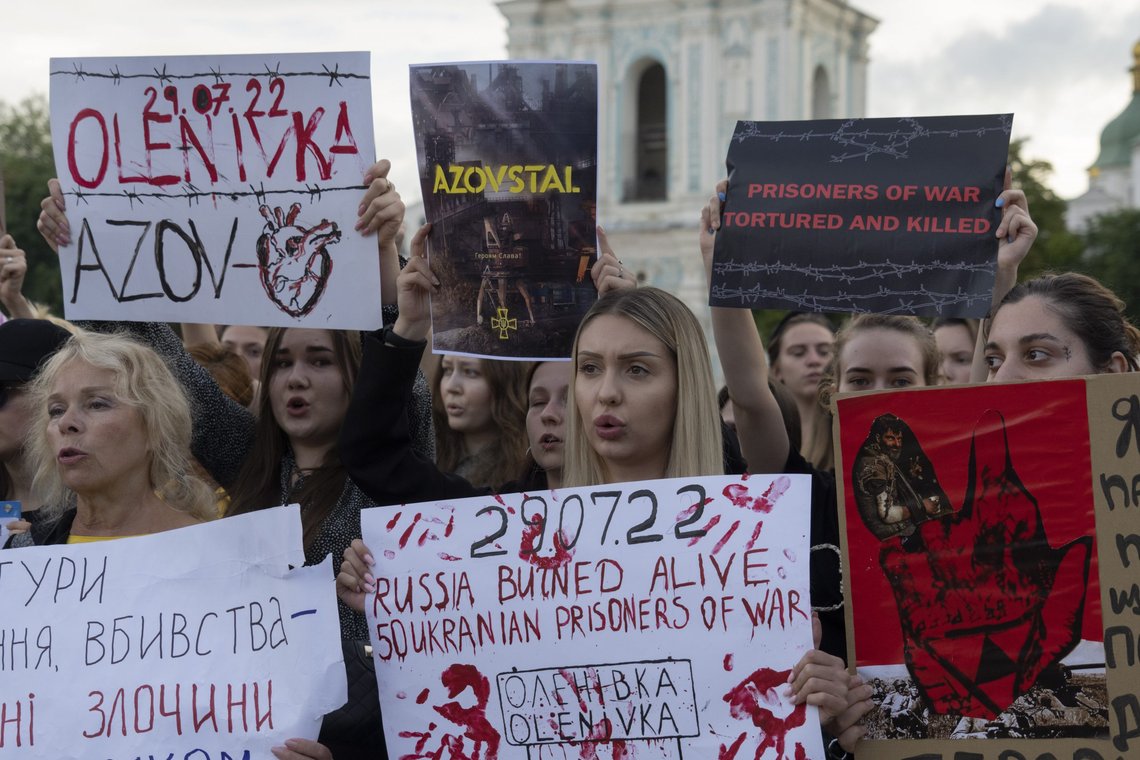 Protesters, mostly relatives, attend a rally in support of Ukrainian soldiers from the Azov Regiment who were captured by Russia in May after the fall of Mariupol, in Kyiv, Ukraine, Thursday, Aug. 4, 2022. The rally comes as U.S. officials believe Russia is working to fabricate evidence concerning last week's deadly strike on a prison housing prisoners of war in a separatist region of eastern Ukraine. (AP Photo/Efrem Lukatsky) Protesters, mostly relatives, attend a rally in support of Ukrainian soldiers from the Azov Regiment who were captured by Russia in May after the fall of Mariupol, in Kyiv, Ukraine, Thursday, Aug. 4, 2022. The rally comes as U.S. officials believe Russia is working to fabricate evidence concerning last week's deadly strike on a prison housing prisoners of war in a separatist region of eastern Ukraine. (AP Photo/Efrem Lukatsky)