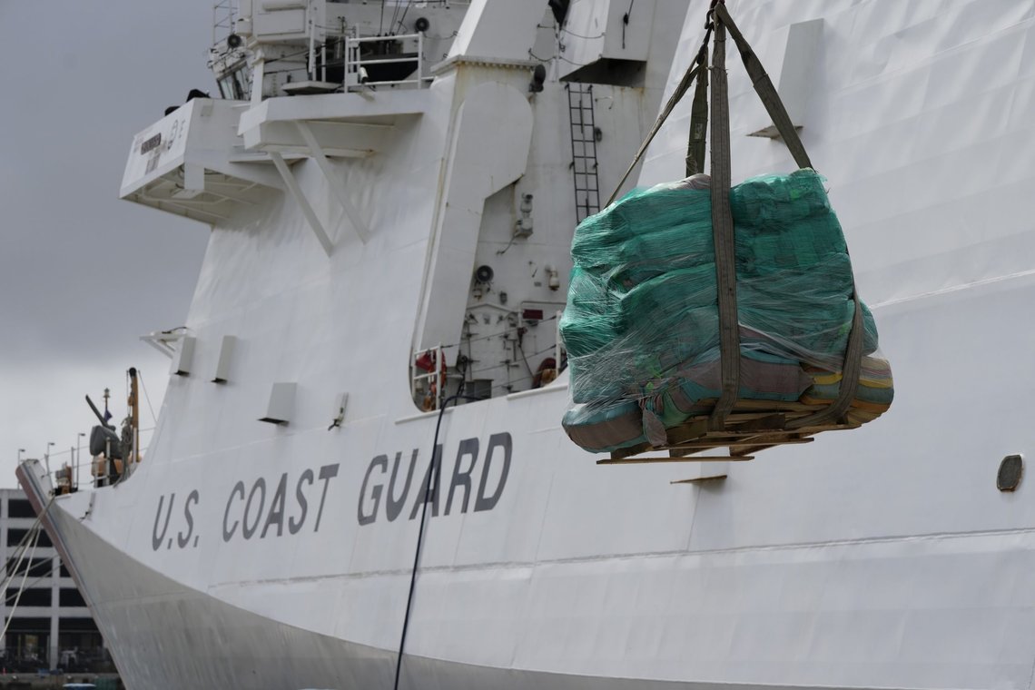 A palette loaded with bundles of seized cocaine and marijuana is lowered down by a crane, as the U.S. Coast Guard unloads more than one billion dollars worth of seized drugs from the Coast Guard Cutter James at Port Everglades, Thursday, Feb. 17, 2022, in Fort Lauderdale, Fla. The Coast Guard said the haul included approximately 54,500 pounds of cocaine and 15,800 pounds of marijuana from multiple interdictions in the Caribbean Sea and the eastern Pacific. (AP Photo/Rebecca Blackwell) A palette loaded with bundles of seized cocaine and marijuana is lowered down by a crane, as the U.S. Coast Guard unloads more than one billion dollars worth of seized drugs from the Coast Guard Cutter James at Port Everglades, Thursday, Feb. 17, 2022, in Fort Lauderdale, Fla. The Coast Guard said the haul included approximately 54,500 pounds of cocaine and 15,800 pounds of marijuana from multiple interdictions in the Caribbean Sea and the eastern Pacific. (AP Photo/Rebecca Blackwell)