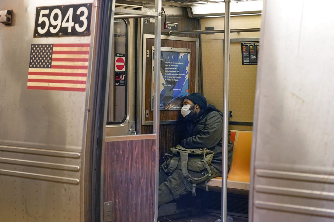 FILE - A man sleeps in a subway car in New York on Feb. 21, 2022. For years, liberal cities in the U.S have tolerated people living in tents in parks and public spaces, but increasingly leaders in places like Portland, Oregon, New York and Seattle are removing encampments and pushing other strict measures that would've been unheard of a few years ago. In New York, Mayor Eric Adams is making a push to try to remove people experiencing homelessness from the city's sprawling subway system with a plan to start barring people from sleeping on trains or riding the same lines all night. (AP Photo/Seth Wenig, File) FILE - A man sleeps in a subway car in New York on Feb. 21, 2022. For years, liberal cities in the U.S have tolerated people living in tents in parks and public spaces, but increasingly leaders in places like Portland, Oregon, New York and Seattle are removing encampments and pushing other strict measures that would've been unheard of a few years ago. In New York, Mayor Eric Adams is making a push to try to remove people experiencing homelessness from the city's sprawling subway system with a plan to start barring people from sleeping on trains or riding the same lines all night. (AP Photo/Seth Wenig, File)