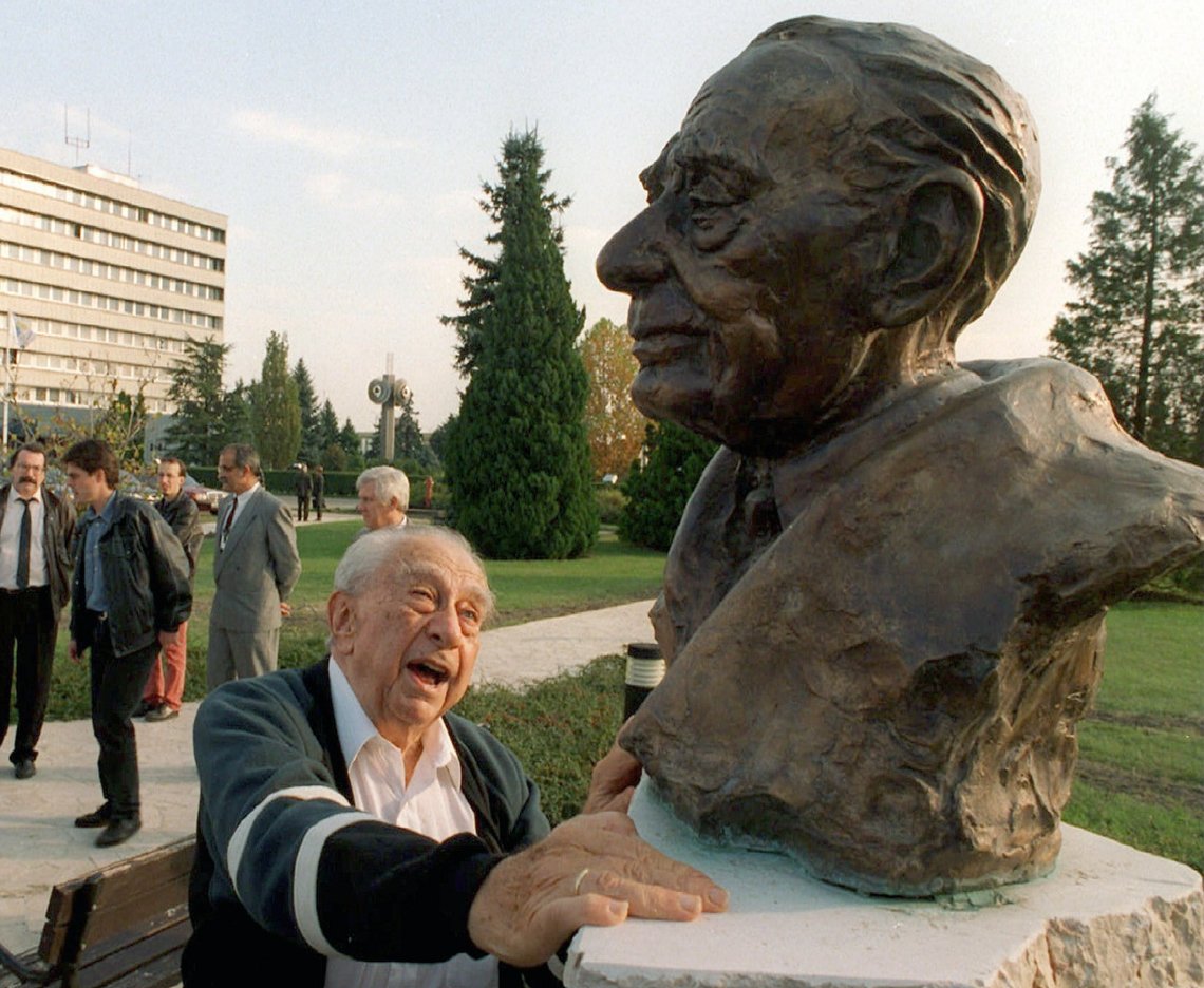 ** FILE ** A file photo of Hungarian-born American physicist Dr. Edward Teller taken in Paks, some 90 kms south of Budapest, Hungary, October 21, 1996, as he touches his bust. Teller, who played a key role in U.S. defense and energy policies for more than half a century and was dubbed the "father of the H-bomb'' for his enthusiastic pursuit of the powerful weapon, died Tuesday, Sept. 9, 2003. He was 95. (AP Photo/MTI, Attila Kovacs, File) ** FILE ** A file photo of Hungarian-born American physicist Dr. Edward Teller taken in Paks, some 90 kms south of Budapest, Hungary, October 21, 1996, as he touches his bust. Teller, who played a key role in U.S. defense and energy policies for more than half a century and was dubbed the "father of the H-bomb'' for his enthusiastic pursuit of the powerful weapon, died Tuesday, Sept. 9, 2003. He was 95. (AP Photo/MTI, Attila Kovacs, File)