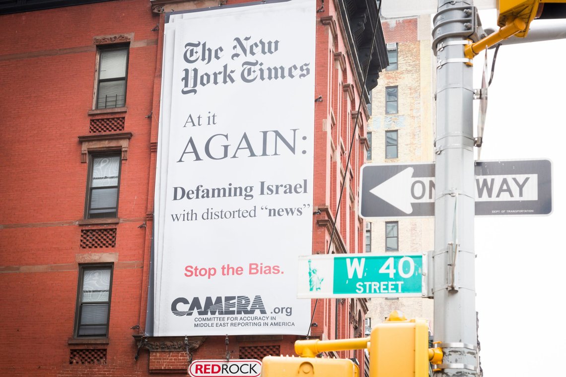 Shutterstock: NEW YORK MAY 28 2018: CAMERA.org billboard posted across from New York Times building on Eighth Ave NYC 28 May 2018. CAMERA acronym is Committee for Accuracy in Middle East Reporting in America. Contributor: Glynnis Jones, USA. Shutterstock: NEW YORK MAY 28 2018: CAMERA.org billboard posted across from New York Times building on Eighth Ave NYC 28 May 2018. CAMERA acronym is Committee for Accuracy in Middle East Reporting in America. Contributor: Glynnis Jones, USA.