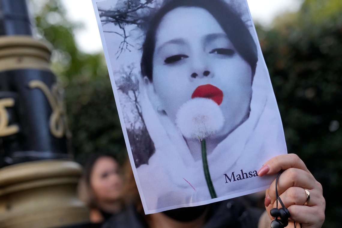 Demonstrators hold placards outside the Iranian Embassy in London, Sunday, Sept. 25, 2022. They were protesting against the death of Iranian Mahsa Amini, a 22-year-old woman who died in Iran while in police custody, who was arrested by Iran's morality police for allegedly violating its strictly-enforced dress code. (AP Photo/Alastair Grant) Demonstrators hold placards outside the Iranian Embassy in London, Sunday, Sept. 25, 2022. They were protesting against the death of Iranian Mahsa Amini, a 22-year-old woman who died in Iran while in police custody, who was arrested by Iran's morality police for allegedly violating its strictly-enforced dress code. (AP Photo/Alastair Grant)