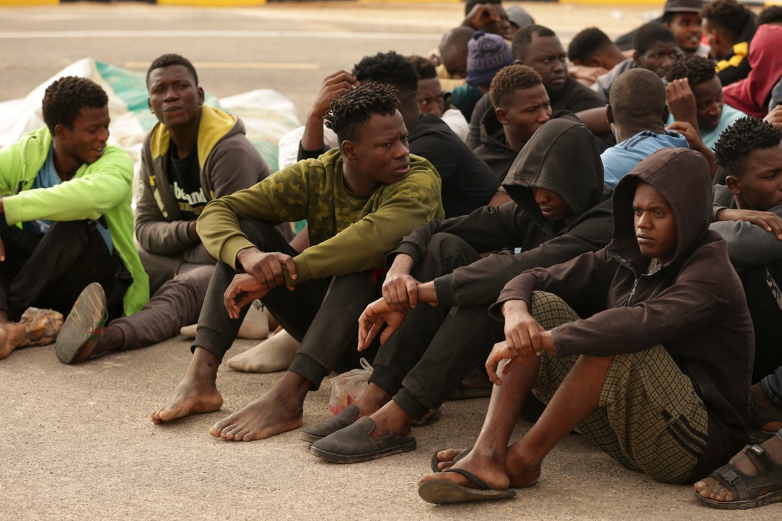 Illegal migrants sit after their boat was intercepted by Libyan authorities in the Mediterranean, some 60 kilometers east of Tripoli, Libya, Thursday, Oct. 20, 2022. (AP Photo/Yousef Murad) Illegal migrants sit after their boat was intercepted by Libyan authorities in the Mediterranean, some 60 kilometers east of Tripoli, Libya, Thursday, Oct. 20, 2022. (AP Photo/Yousef Murad)